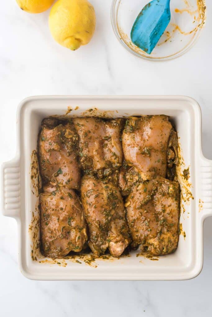 chicken thighs marinating in chermoula sauce