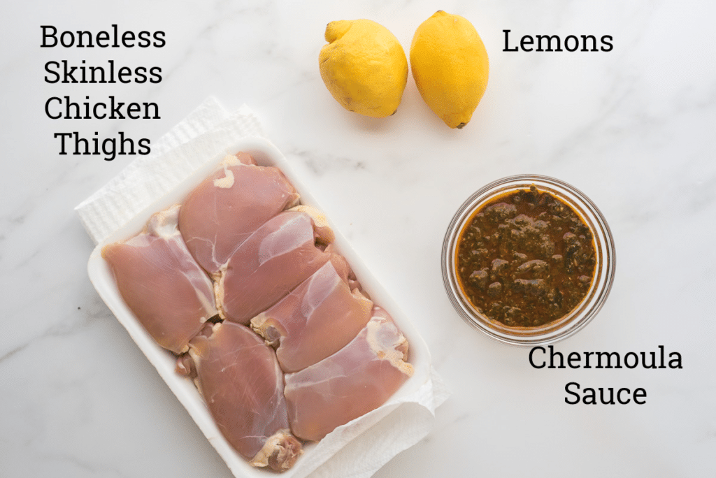ingredients for chermoula chicken on white background with text labels