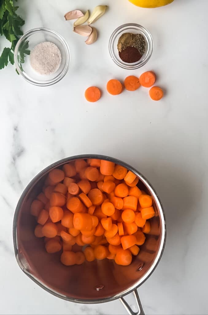 cooking sliced carrots in small saucepan 