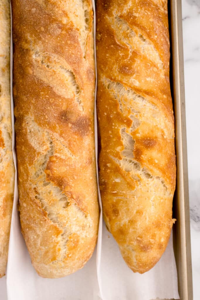 close up of freshly baked baguette in pan