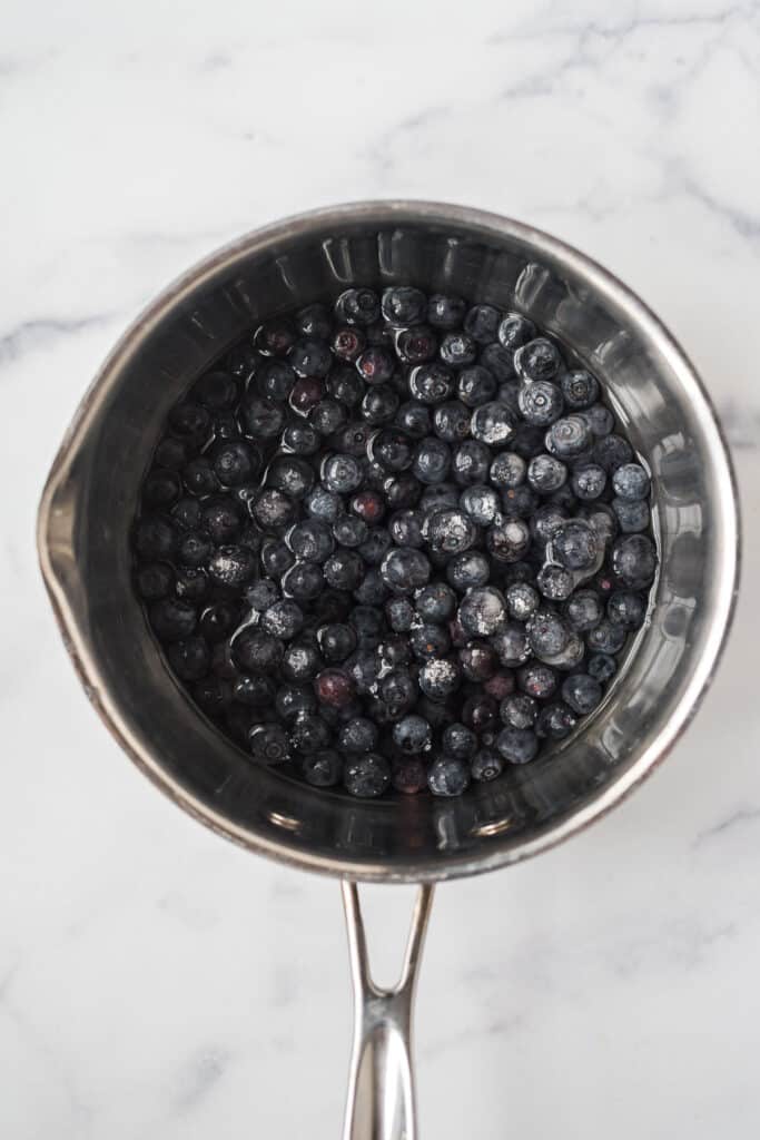 saucepan with blueberries and water