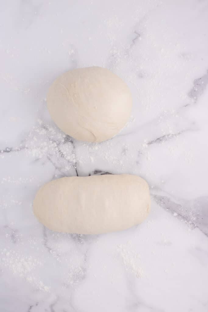 dough divided into two sections - one in a ball and one in a loaf