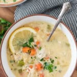 bowl of chicken soup with lemon