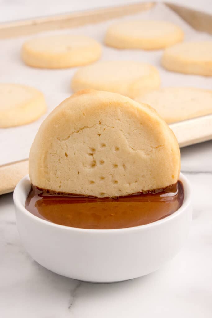 dunking cookie in melted chocolate