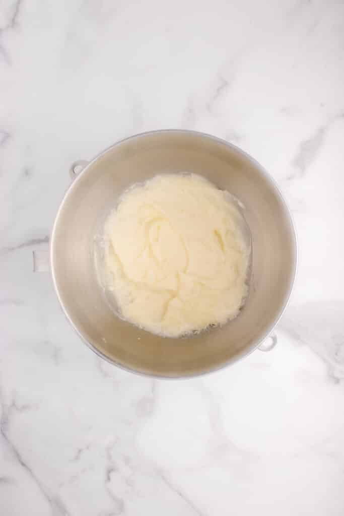 butter and sugar creamed in metal mixing bowl