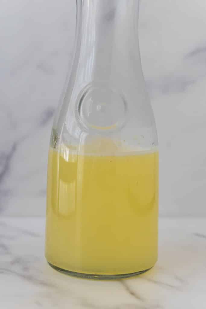 pitcher with lemon juice and simple syrup