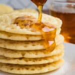stack of moroccan pancakes with honey being drizzled on top