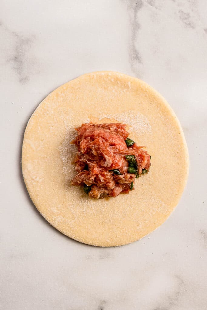 circle of dueling wrapper with ground beef filling