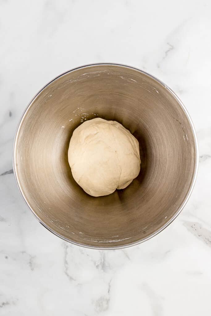 metal mixing bowl with dough for asian dumplings