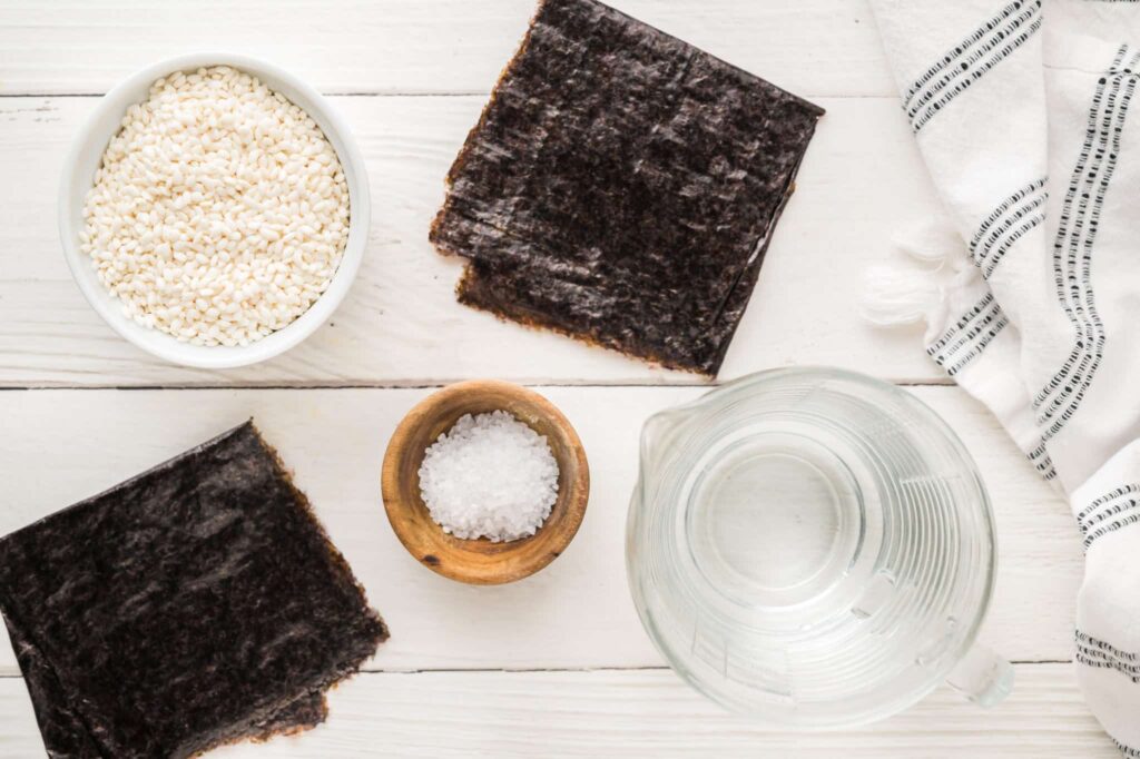 ingredients for onigiri on white wooden counter