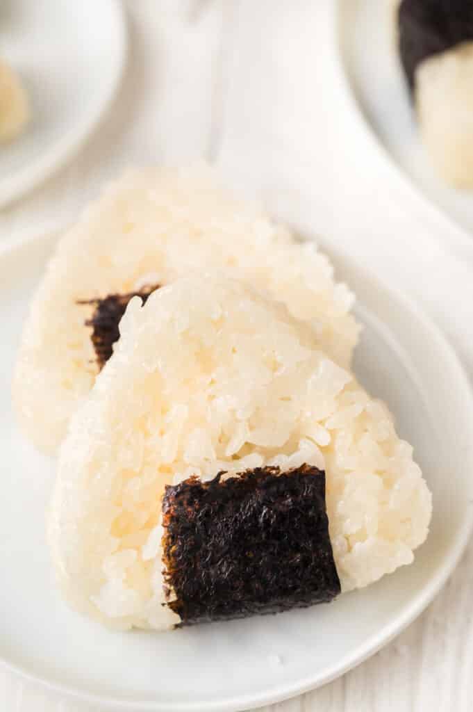two onigiri on white plate